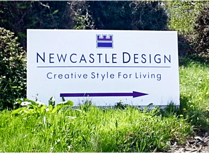 newcastle-design-sign-board-on-grass-patch