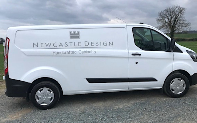 signwriting on the side of a white van